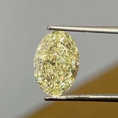 2.02 carat GIA certified oval modified brilliant diamond — glowing with soft warmth in the W to X color range and super clean VS1 clarity. 