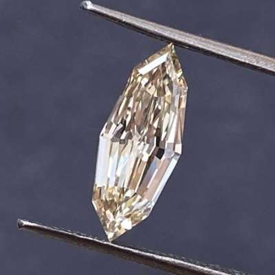  1.00ct natural champagne brown vs2 clarity marquise is long and lean, stretching to nearly 12mm
