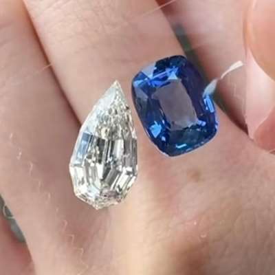  On one side: a Natural GIA M-color step-cut pear diamond, 2.12cts (VVS1 clarity), AND On the other: a Natural GRS unheated Blue Sapphire, rich and pure in tone—an unheated rarity that radiates life and depth.