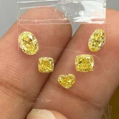  five diamonds in five different silhouettes, shade of fancy yellow total 1.66cts, each with VS clarity , oval, cushion, heart, radiant shape