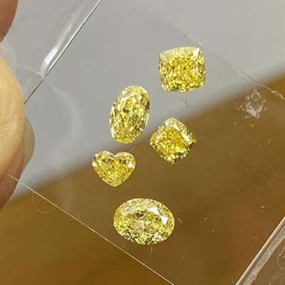  total 1.66cts, each with VS clarity,  shade of fancy yellow and every shape brings its own personality to the mix: oval, cushion, heart, radiant…