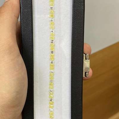  7.94cts total weight layout featuring 52 dazzling diamonds. This mix includes 18 natural G color VS clarity emerald cuts paired with 34 natural fancy yellow VS clarity radiant cuts.