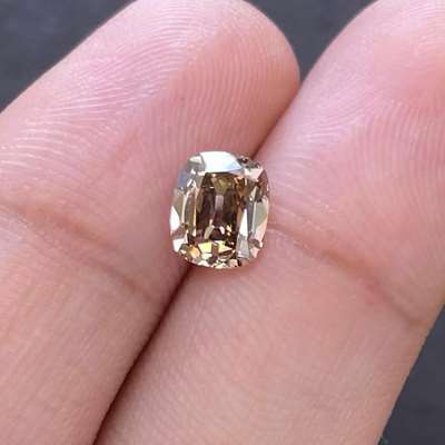 1.26ct old cut cushion has a warm brown hue with VS1 clarity,