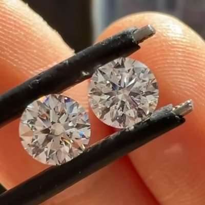 0.54ct & 0.55ct GIA certified Matching pair of Natural E Color VVS1 Clarity Round Brilliant Cut Diamonds