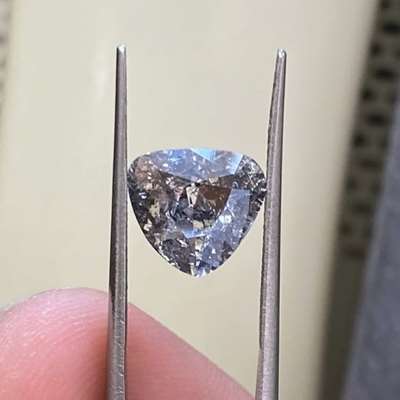 This 2.05cts antique triangular salt and pepper diamond is one of those pieces that instantly pulls you in.