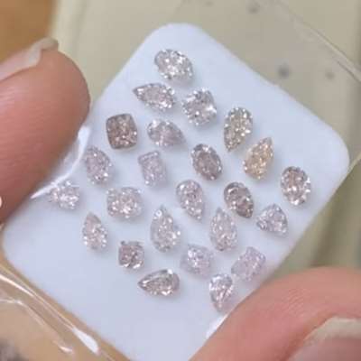 A 2.17cts total weight parcel of 24pcs Natural brownish pink VS–SI clarity mix shape diamonds
