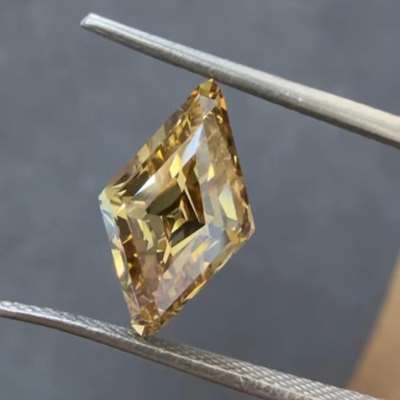 A powerful 2.73cts natural brownish yellow VS2 clarity lozenge shape diamond