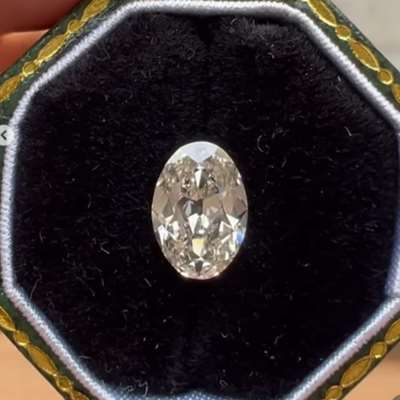 A 0.99cts GIA certified natural K color, faint brown VS1 clarity old cut oval shape diamond 