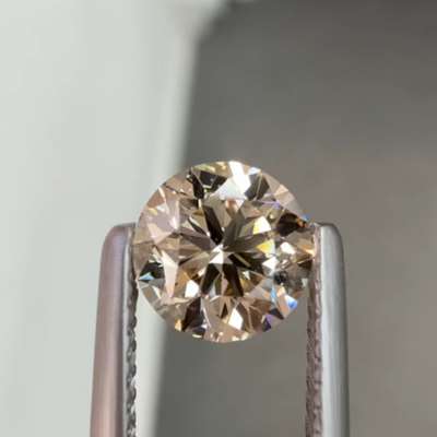 0.96ct GIA certified natural U-V range, light brown VS2 round brilliant cut diamond