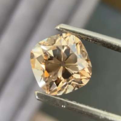 A 1ct natural peachy brown VS2 clarity old cut cushion shape diamond