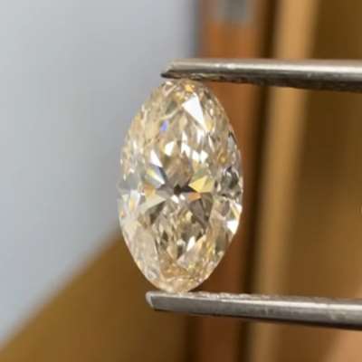 A 1ct natural peachy brown VVS2 clarity old cut oval shape diamond 