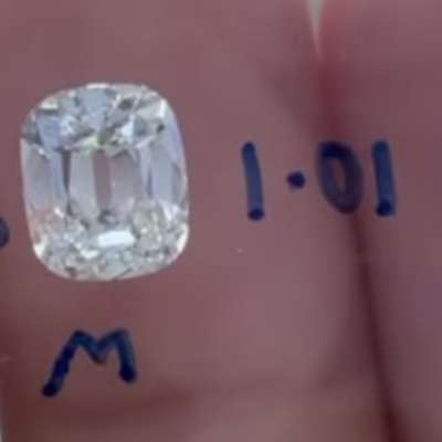  1.01cts natural M color VS2 clarity old cut cushion shape diamond.