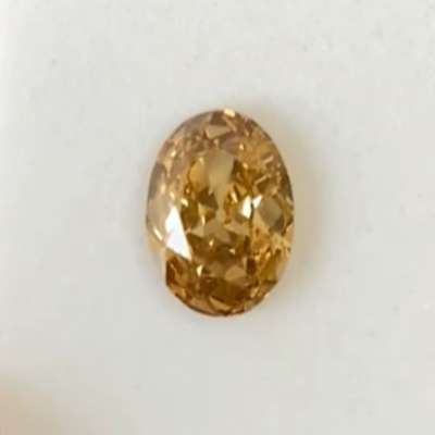A 1.16ct natural honey brown old cut oval diamond with SI2 clarity