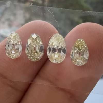 Four natural light yellow old cut egg shape diamonds, coming in at a beautiful 2.76cts total weight, each with VS1 clarity