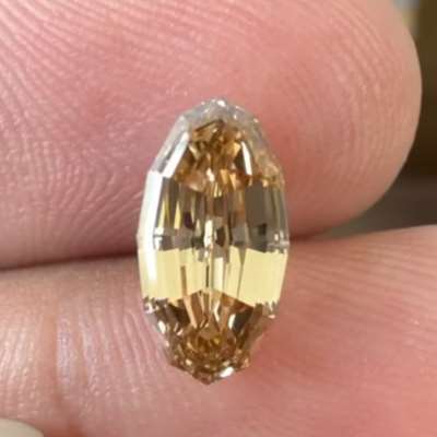 1.70cts natural vibrant honey brown VVS2 clarity step cut oval diamond
