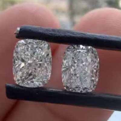 Two 0.90ct GIA certified natural cushion diamonds, IF clarity