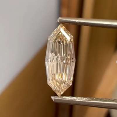 A 1.01ct natural peachy brown VS1 clarity step cut marquise shape diamond 