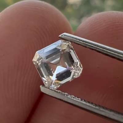 A 0.67ct Natural M color, faint brown SI1 clarity Asscher cut diamond 