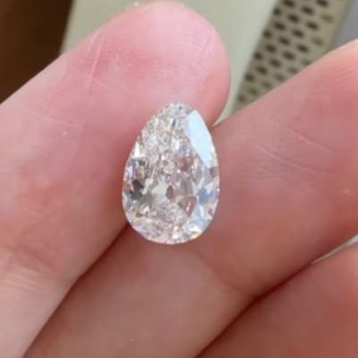 A 1.94cts GIA certified natural L color, faint brown SI1 clarity old cut pear shape diamond 