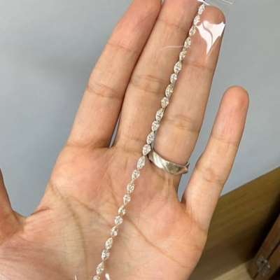 2.11cts total weight featuring 7 natural light peachy brown VS2 clarity pear shape diamonds