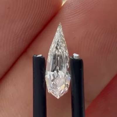 A 0.43cts GIA certified Natural J color VS2 clarity long step cut pear shape diamond 