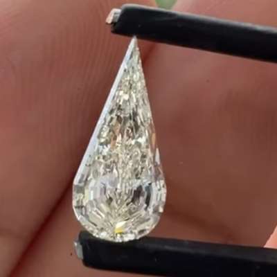 A 1ct GIA certified natural N color pear step cut