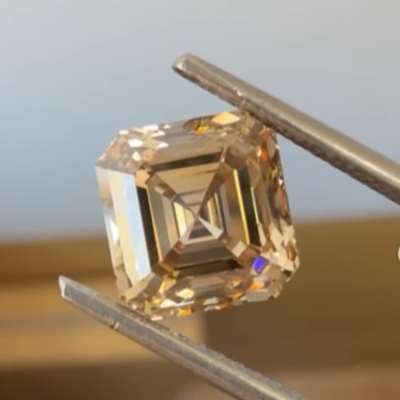 A 2.51ct natural peachy brown Asscher cut with VS1 clarity
