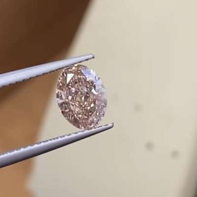 A 1.58ct GIA certified natural fancy orange-brown oval with VS1 clarity 