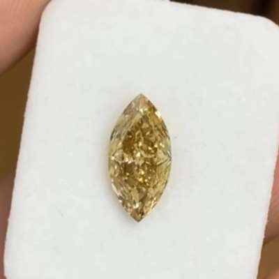 A 1.12cts natural yellowish brown VVS2 clarity marquise shape diamond 