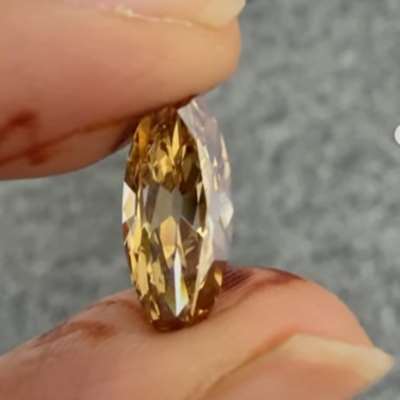 2.05cts natural orangy brown VS1 clarity old cut long moval diamond