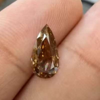 1.01cts natural dark brown SI2 old cut pear shape diamond