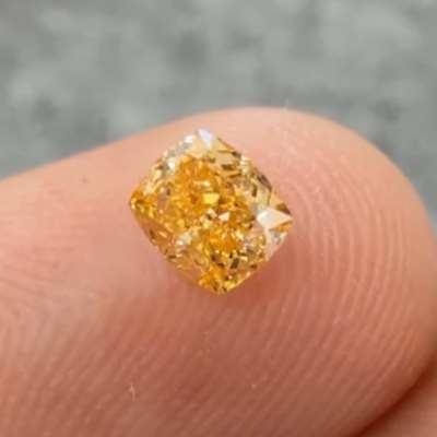  0.35cts GIA certified natural Fancy Intense yellow-orange VS2 cushion shape diamond