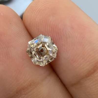 1.23cts natural peachy brown VS1 old cut Asscher shape diamond. 