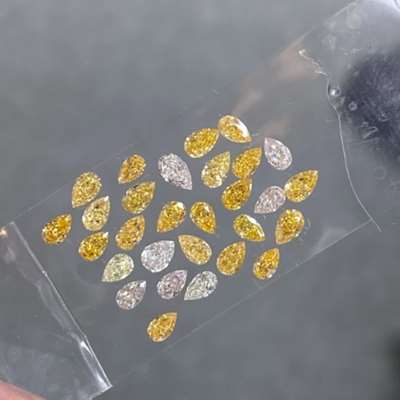 3.03ct total. Natural mix color pear shape diamond layout