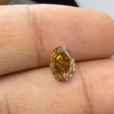 1.41cts natural orangy brown VS1 oval shape diamond