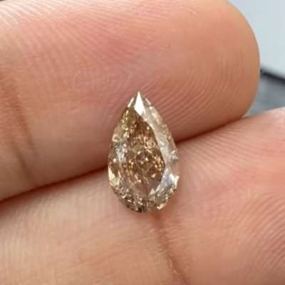 1.08cts natural peachy brown VS1 pear shape diamond