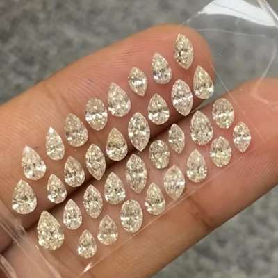  34 natural light peachy brown VS-SI diamonds, with a beautiful mix of pear and marquise shapes. 