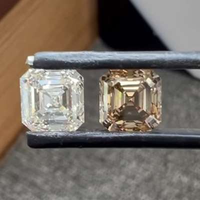 A 2.01ct GIA certified natural J color VS1 Asscher paired with a 2.01ct natural brown SI2 Asscher.
