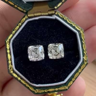  This beautiful pair features a 1.03ct and 1.00ct natural M color VVS2 Peruzzi cut diamonds.