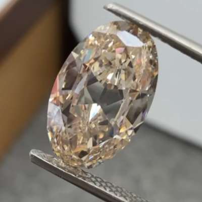 A 3.00ct natural light peachy brown SI2 old cut oval with beautiful cutting