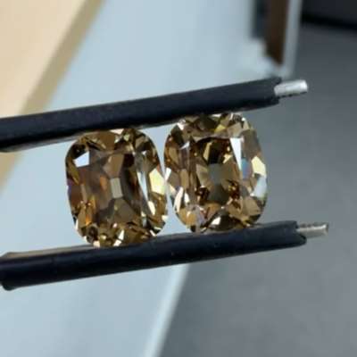  2.01ct & 2.00ct GIA certified natural Fancy Dark Yellowish Brown SI1 diamond pair