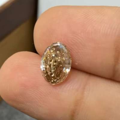 2.11ct natural peachy brown VVS2 oval step cut diamond 