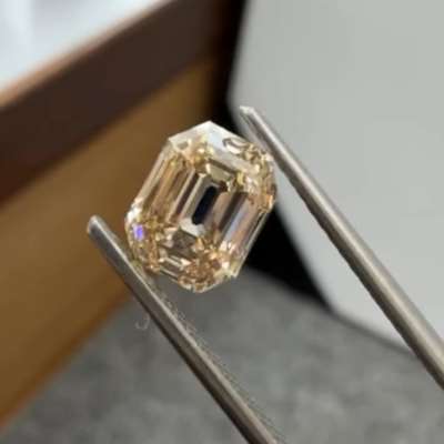 1.72ct Emerald Cut diamond has VS1 clarity and a warm, yellowish-brown tone