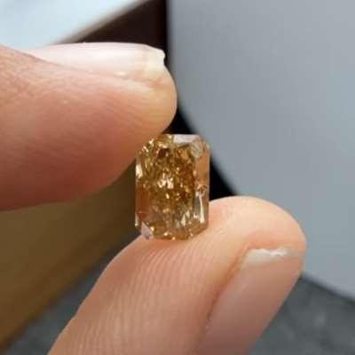 1.37-carat natural SI clarity long radiant cut diamond in a breathtaking honey brown color