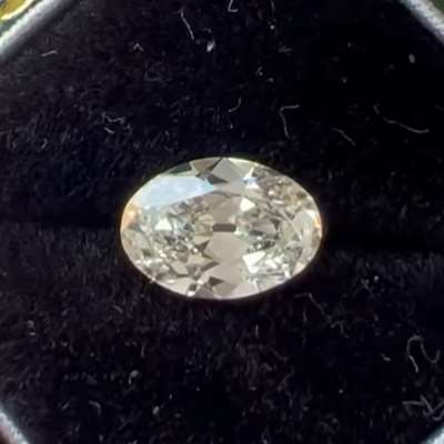 A 0.99cts GIA certified Natural K color, faint brown VS1 clarity old cut oval shape diamond