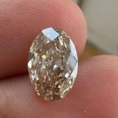 A 1.89ct natural peachy brown oval with VS2 clarity