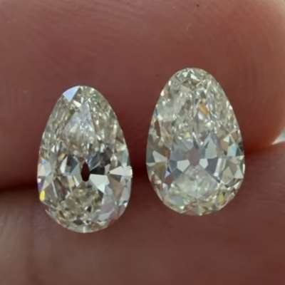 A gorgeous duo of old cut egg shape diamonds, 0.67ct and 0.68ct, GIA certified in natural L color with VVS1 and VS2 clarity.