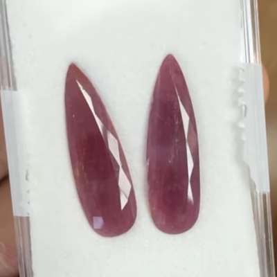 A 17.06cts total weight pair of Natural ruby pear shape gemstones,