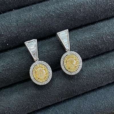Oval Shape Yellow Diamond Dangling Earings With 6pcs trapazoid Set Set In 18k Gold.