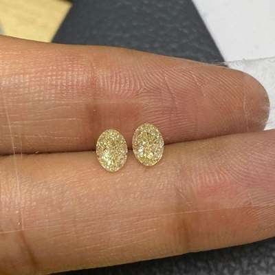 1.17ct Total Weight Matching Pair Of Natural Fancy Light Yellow VVS-VS Clarity Oval Shape Diamonds